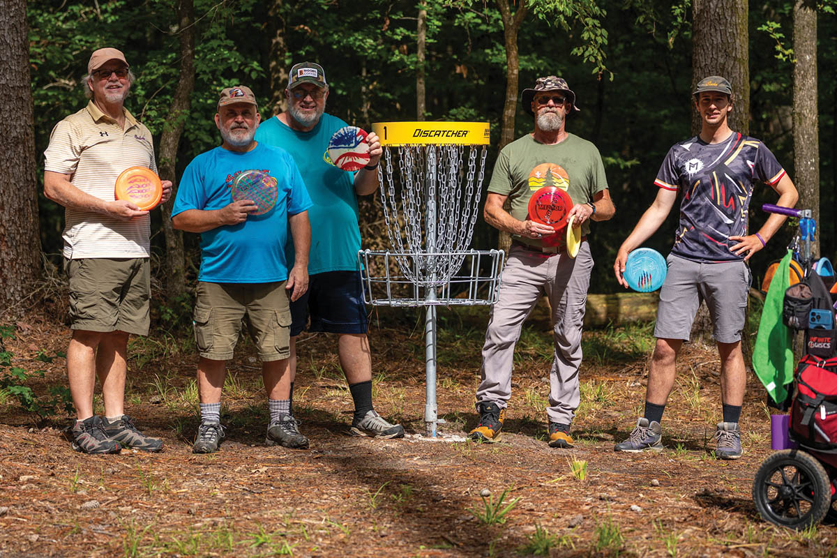 A professionally designed, 18-hole disc golf course weaves through hardwood forest.